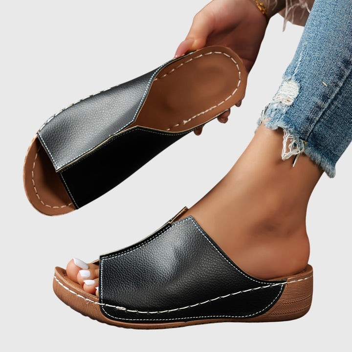 Women's open-toe flat sandals with adjustable straps, ergonomic design for ultimate summer comfort.