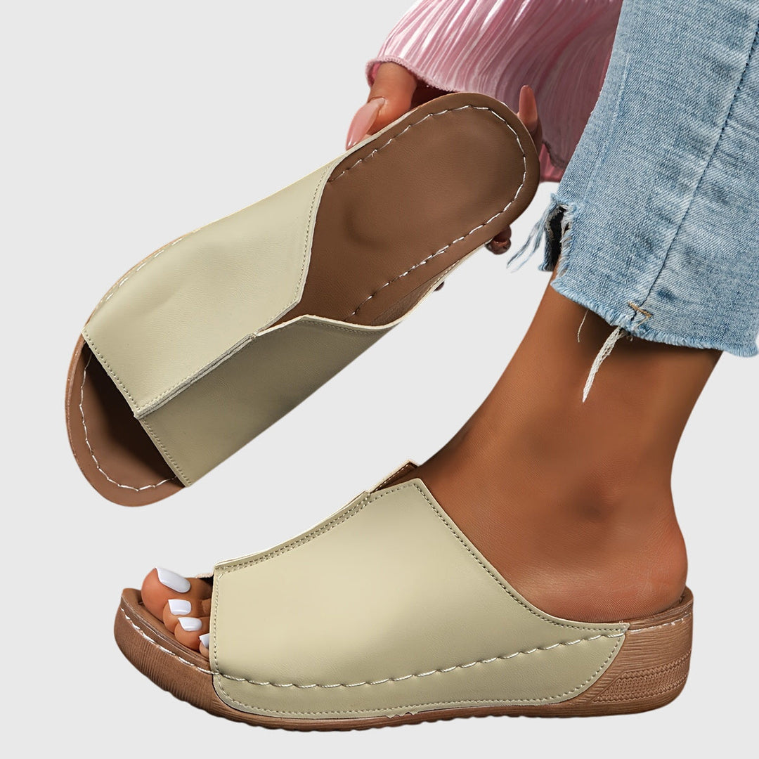 Sleek open-toe flat sandals for women, ergonomic design provides superior comfort for warm weather.