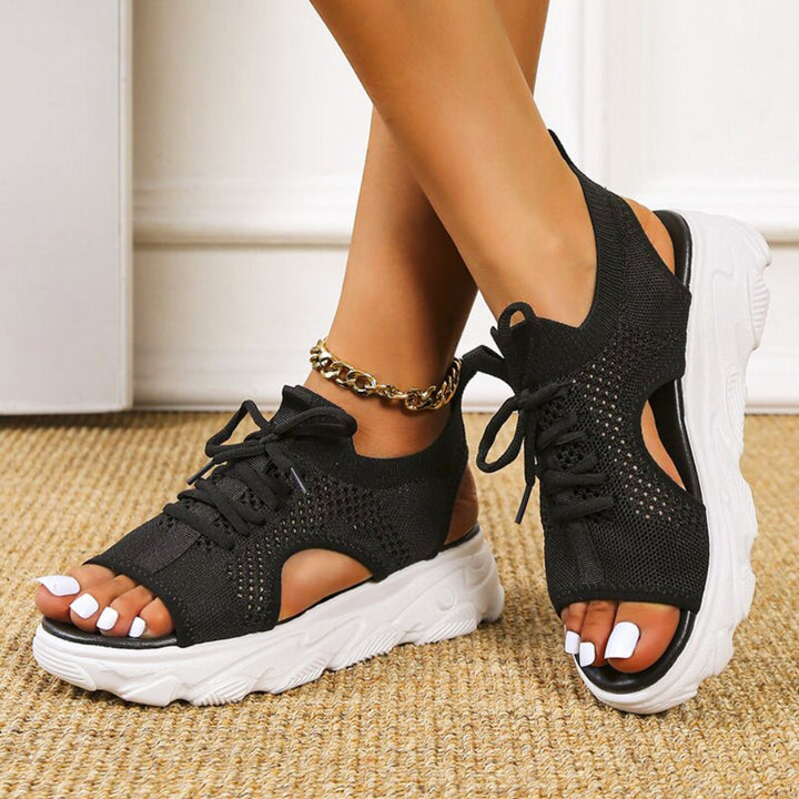 Women's open-toe platform sandals featuring trendy lace-up closure for a secure, fashionable fit.