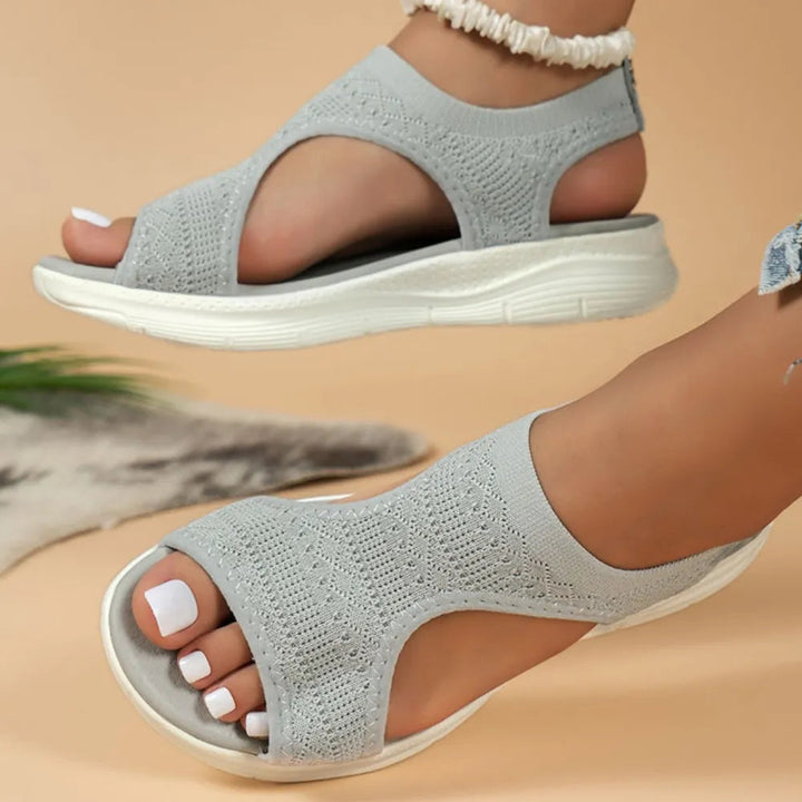Women's orthopedic sandals with arch support, non-slip sole for secure, stable steps.
