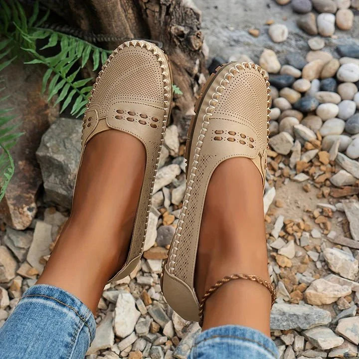 Perforated slip-on loafers for women, offering orthopedic comfort and casual style.