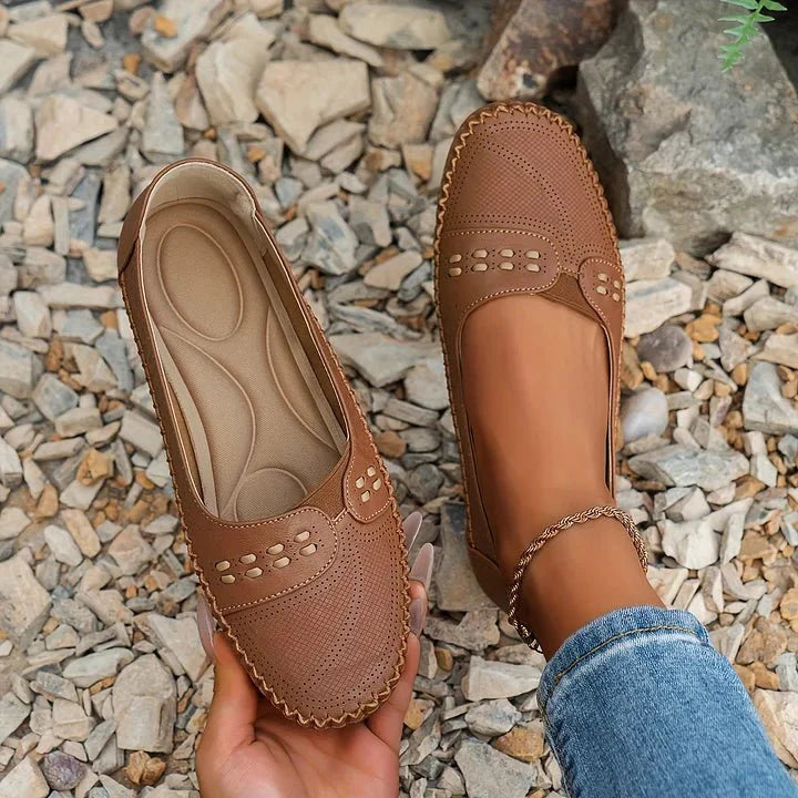 Stylish women's perforated loafers, slip-on design for easy, comfortable wear.
