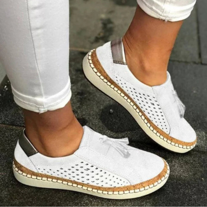 Comfortable women's slip-on shoes for travel & everyday wear. Features orthopedic arch support & breathable design.
