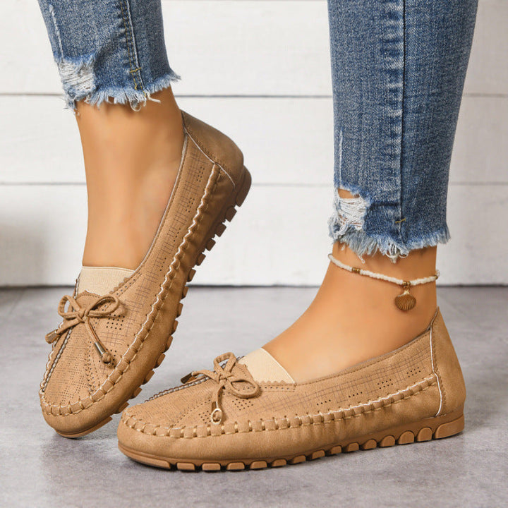 Women's orthopedic wide fit slip-on loafers for cushioned walking comfort.