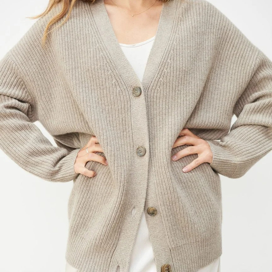 Comfortable women's oversized button-up cardigan, a versatile layering piece for cold weather.