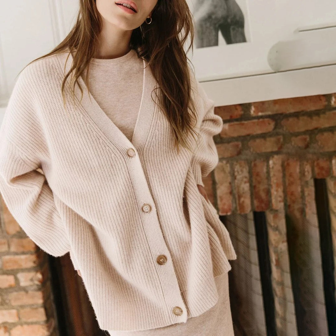 Warm women's oversized button-up cardigan, a stylish layering option for fall and winter.