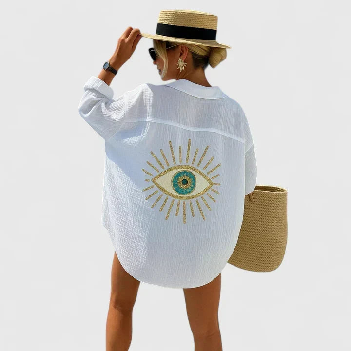 Stylish women's embroidered Evil Eye button-down shirt. An oversized top, ideal for beach, resort wear & vacation outfits.