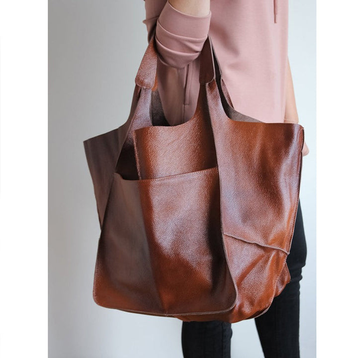 Chic oversized vintage leather shoulder bag, a stylish women's fashion statement.