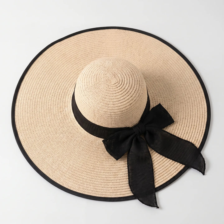 Floppy wide brim women's sun hat, a fashionable summer accessory for beach and vacation.