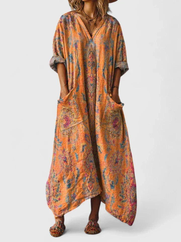 Bohemian style women's summer maxi dress featuring a vibrant paisley pattern, V-neck, and useful pockets.