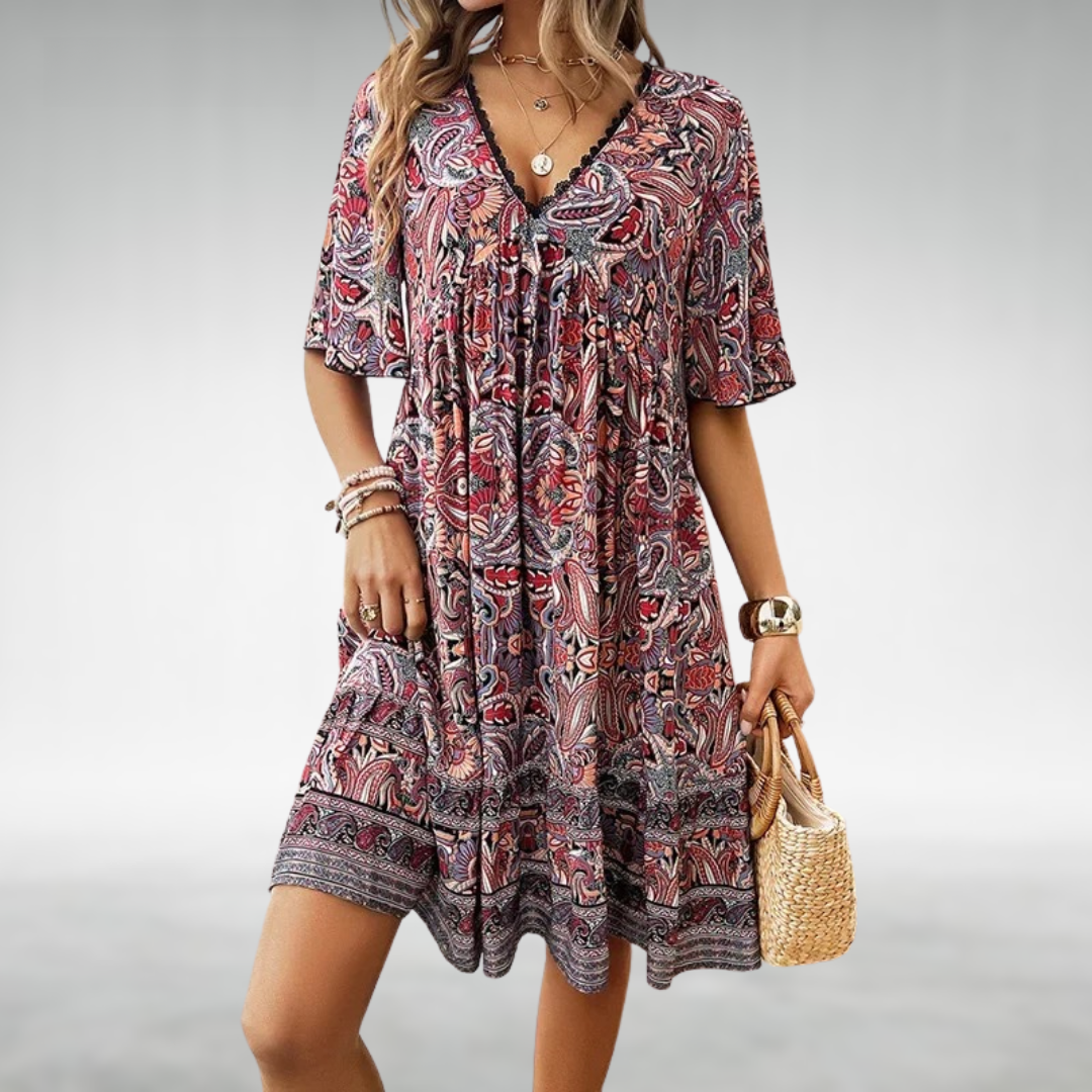 Vibrant paisley boho mini dress for women with delicate lace trim, ideal for summer casual or festival days.