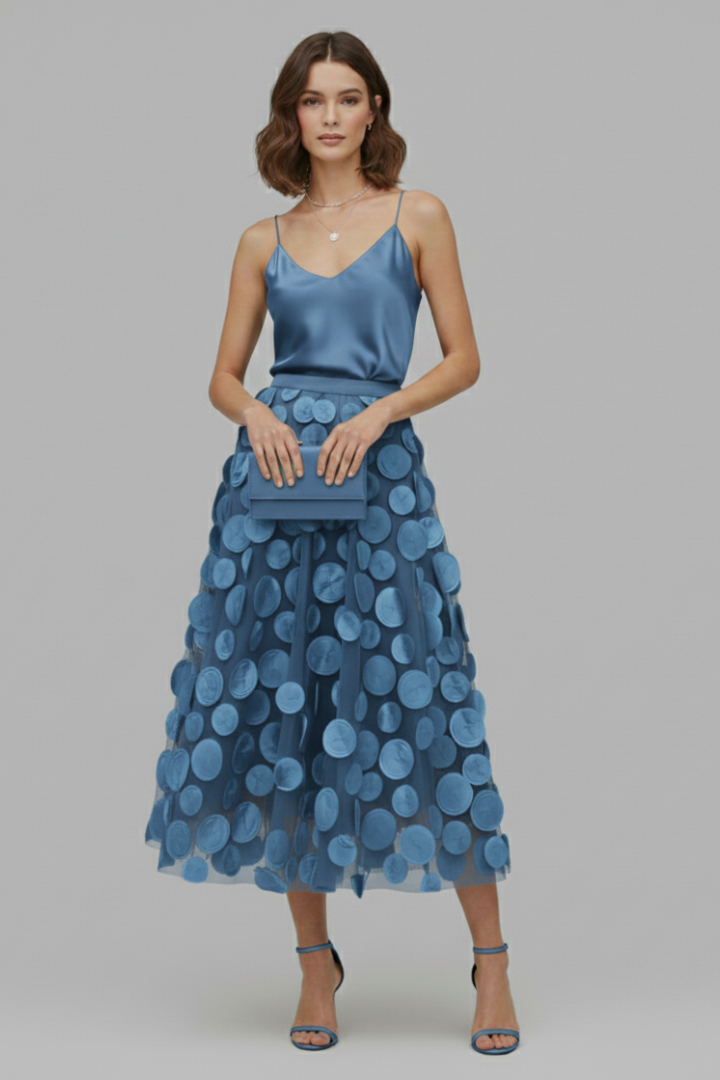 Women's stylish polka dot full skirt with elastic waist. A-line design for casual chic and elegant evening wear.