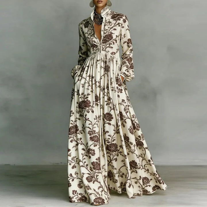 Flowy bohemian maxi dress for women, featuring a vibrant print, long sleeves, and a stylish high waist.