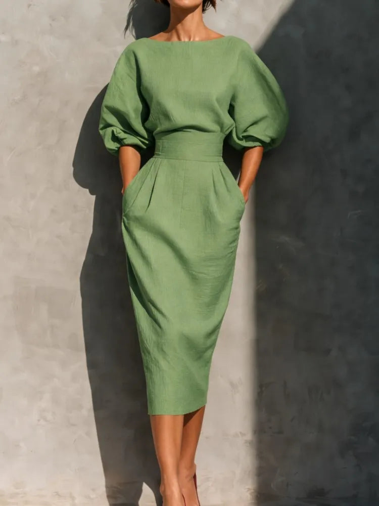 Chic women's puff sleeve midi party dress with pockets, an elegant and modest option for special occasions.