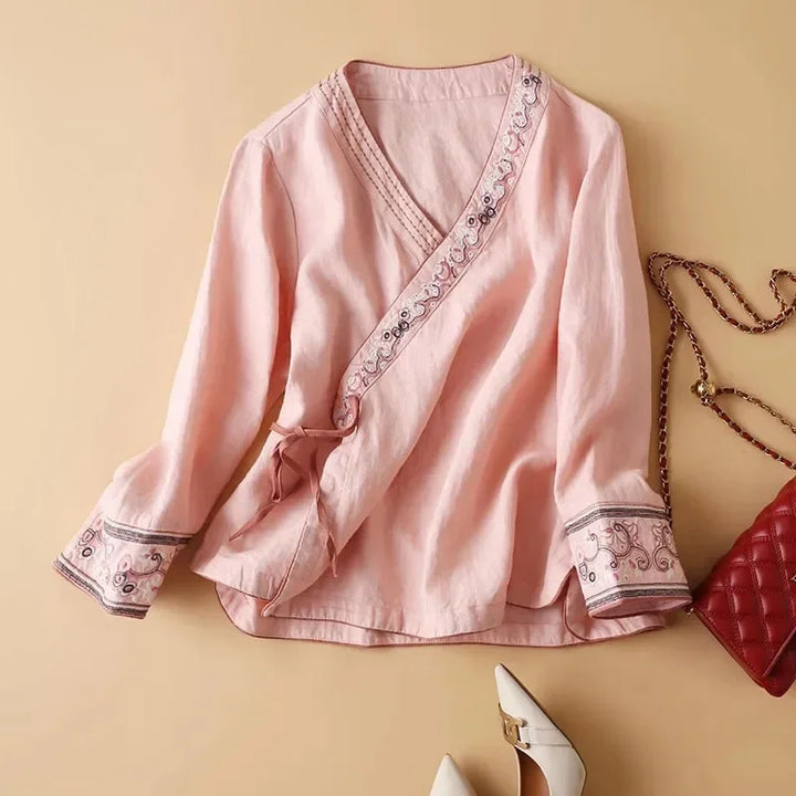 Women's purple patterned blouse, relaxed fit, elegant V-neck embroidery.