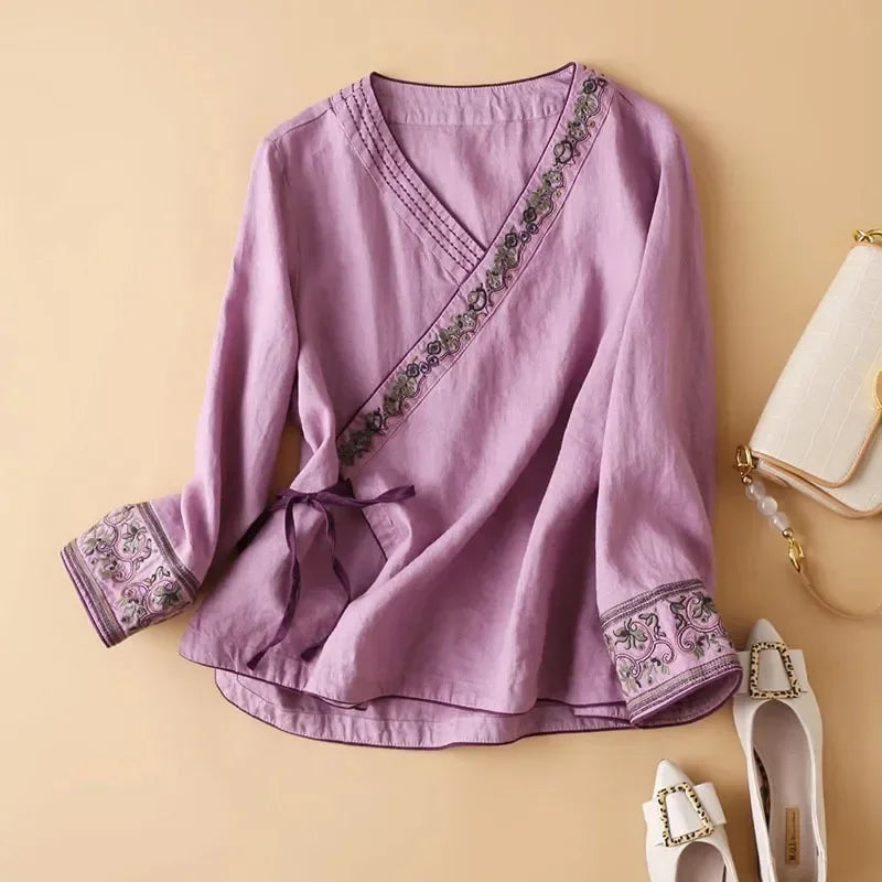 Red patterned ladies' top, relaxed fit, stylish V-neck embroidery for casual chic.