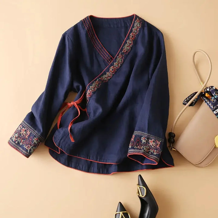 Casual chic patterned V-neck blouse, women's relaxed fit, stylish embroidery.
