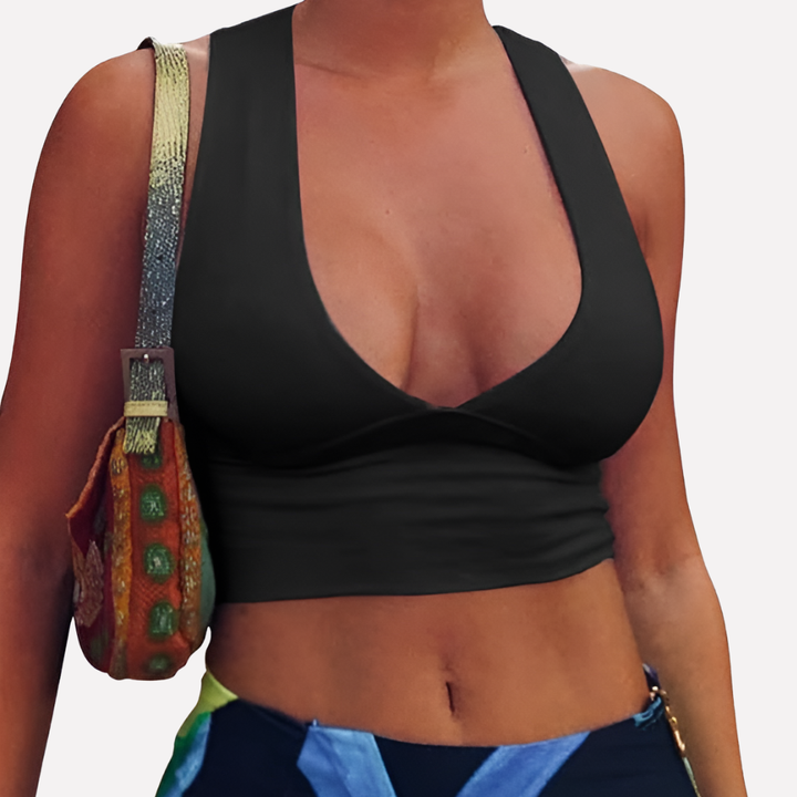 Trendy women's fitted racerback crop top with cutouts & a deep V-neck; ideal sleeveless summer casual wear.