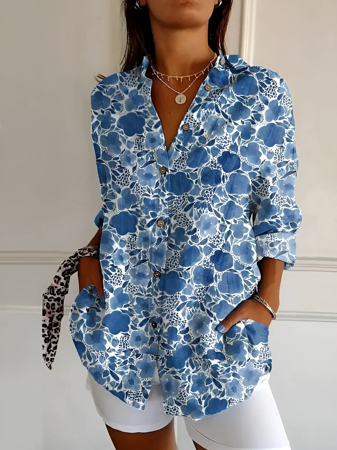 Versatile women's button-down long-sleeve blouse, ideal relaxed fit top for office or casual occasions.
