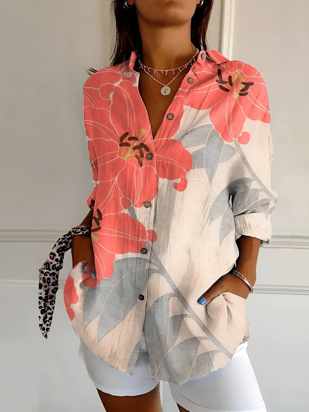 Stylish women's v-neck relaxed fit blouse with pocket detail, comfortable long-sleeve casual top.