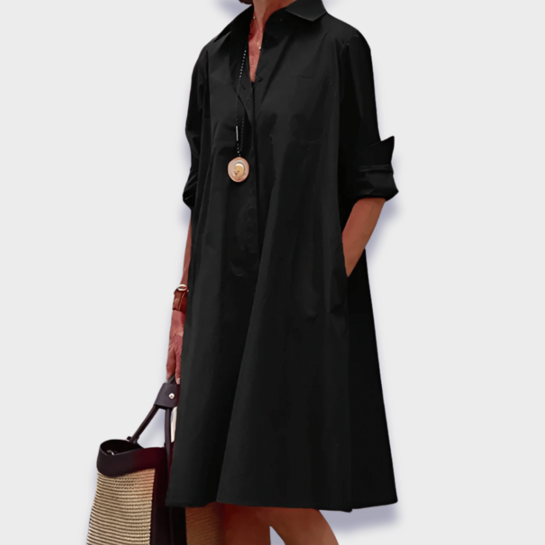 Flowy women's button-up midi shirt dress, ideal for vacation, summer, or elegant casual everyday wear with pockets.
