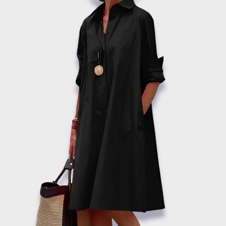 Flowy women's button-up midi shirt dress, ideal for vacation, summer, or elegant casual everyday wear with pockets.