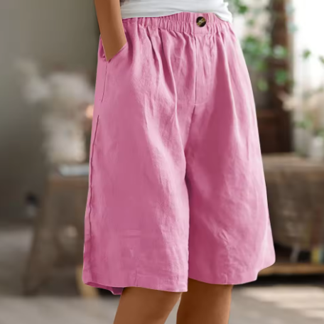Fashionable women's relaxed fit Bermuda shorts, high-waisted for casual summer style. Comfortable elastic waist.