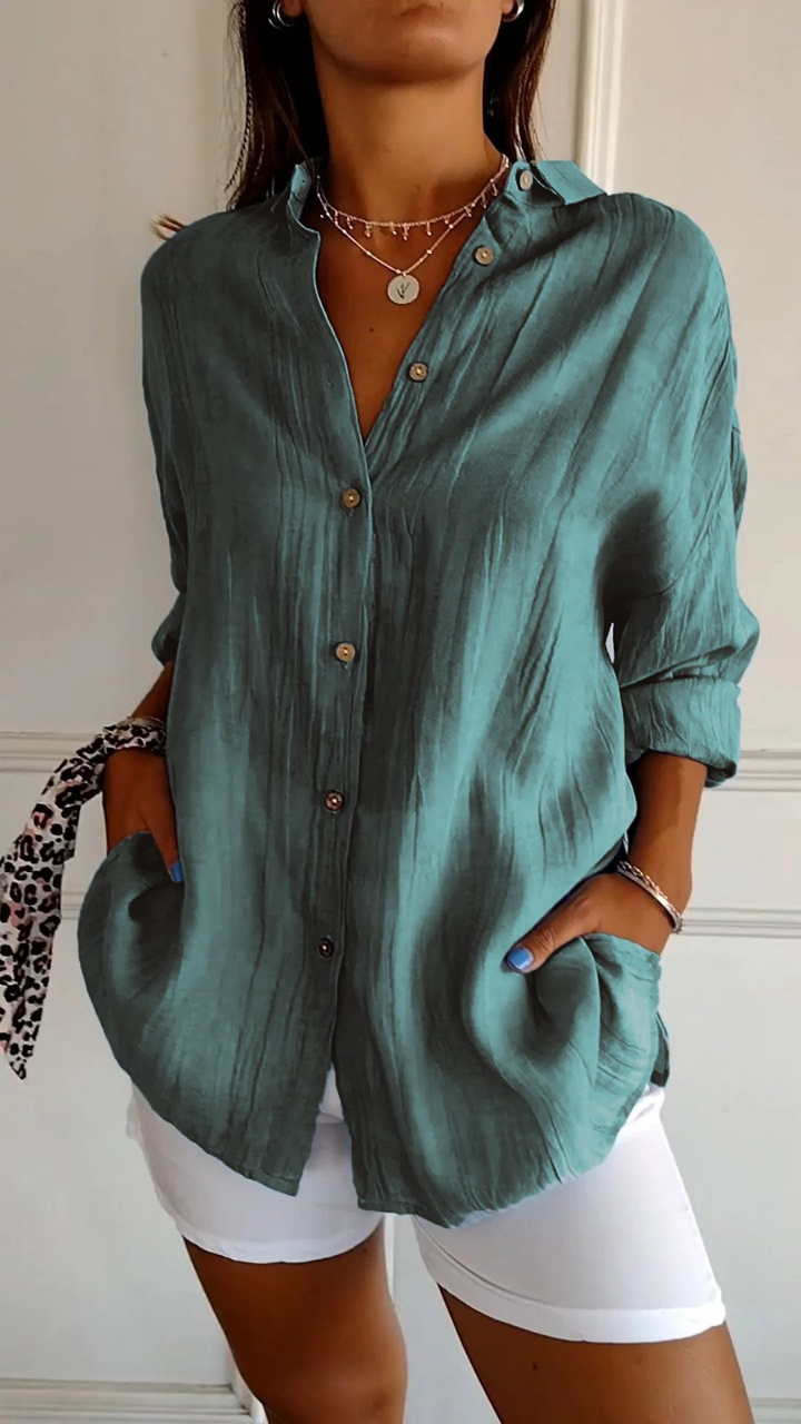 Crisp cotton women's oversized long sleeve button-up, a classic casual blouse.
