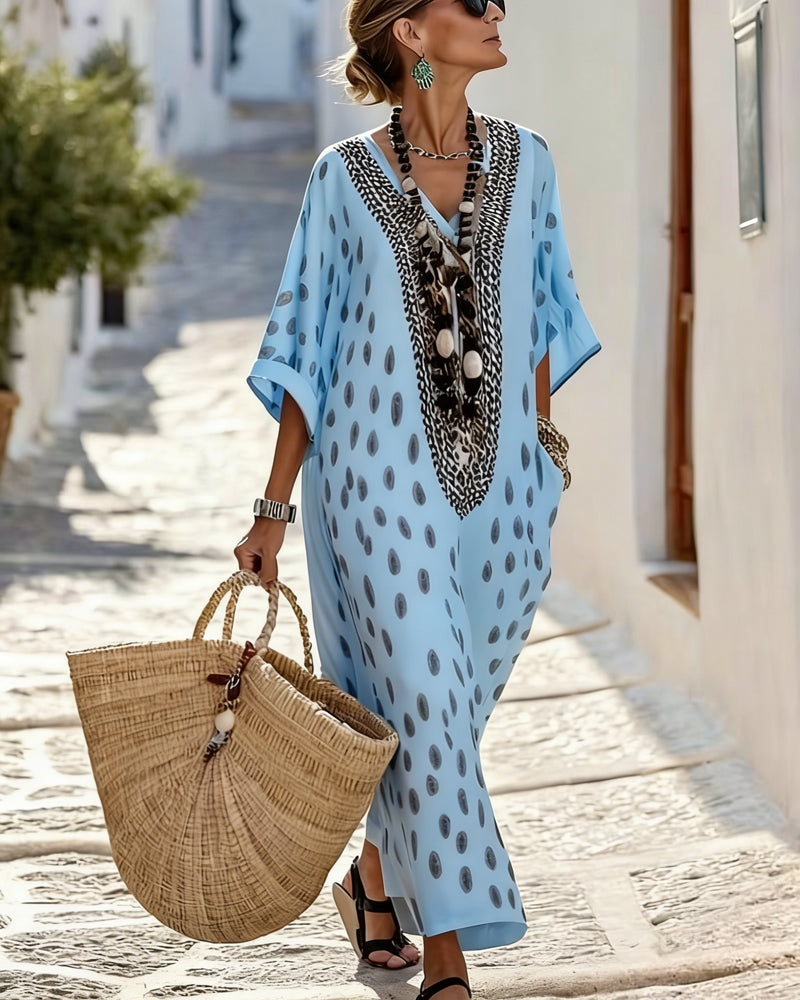 Stylish V-neck polka dot maxi kaftan dress for women. Relaxed fit for comfortable summer fashion.