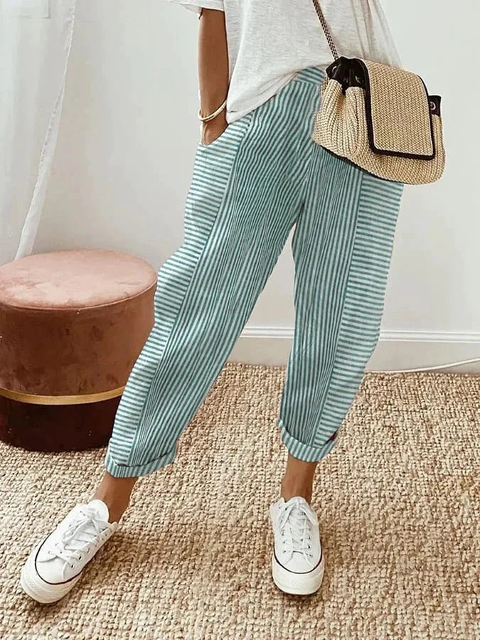 Side view of women's comfortable straight leg striped trousers, perfect for spring & summer casual wear.