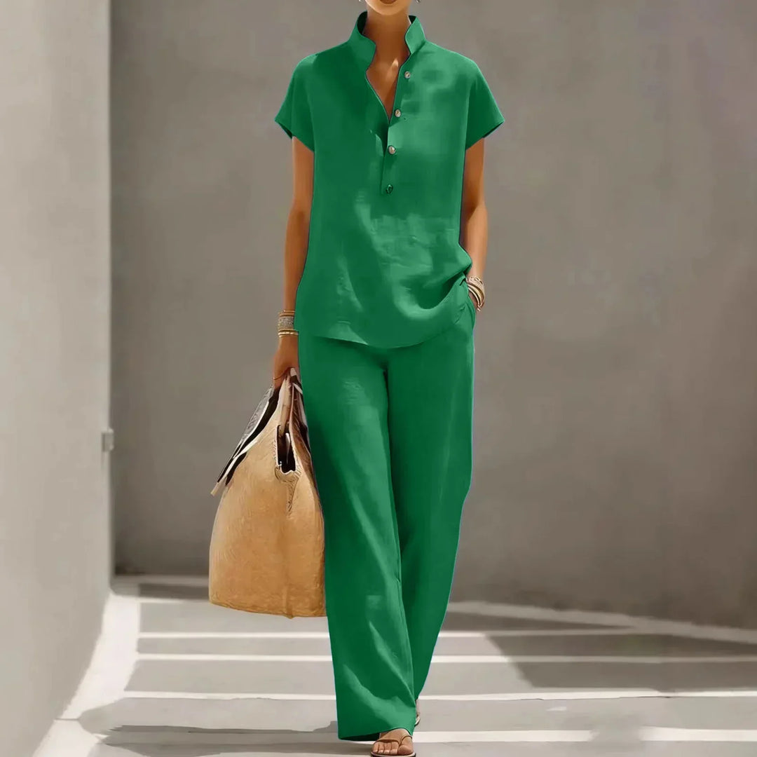 Relaxed fit ladies' two-piece summer outfit featuring a short-sleeve top and flowy wide-leg pants. Casual style.