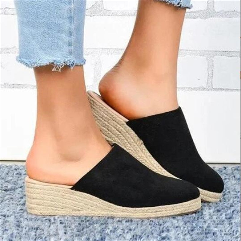 Chic women's platform wedge sandals, versatile for everyday wear and summer comfort.