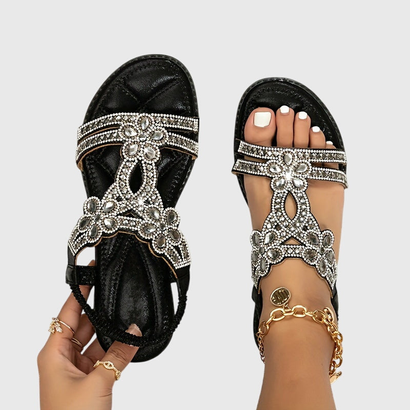 Chic women's flat sandals, combining boho style with sparkling rhinestones.