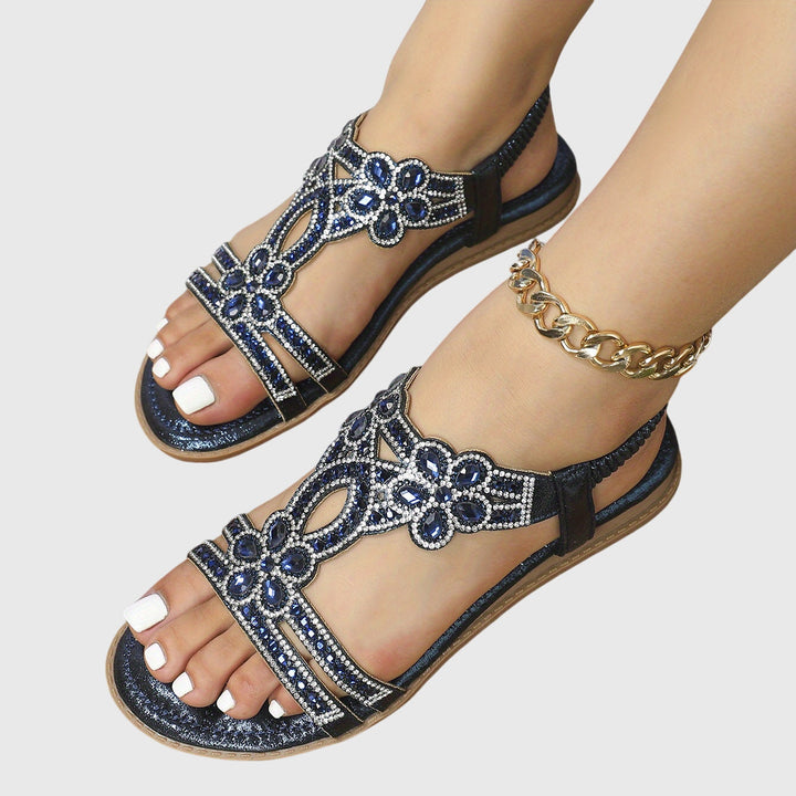 Glamorous women's rhinestone flat sandals, ideal for resort fashion.