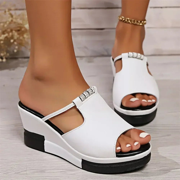 Stylish women's platform wedge slide sandals with sparkling rhinestones. Perfect for comfortable summer casual wear.