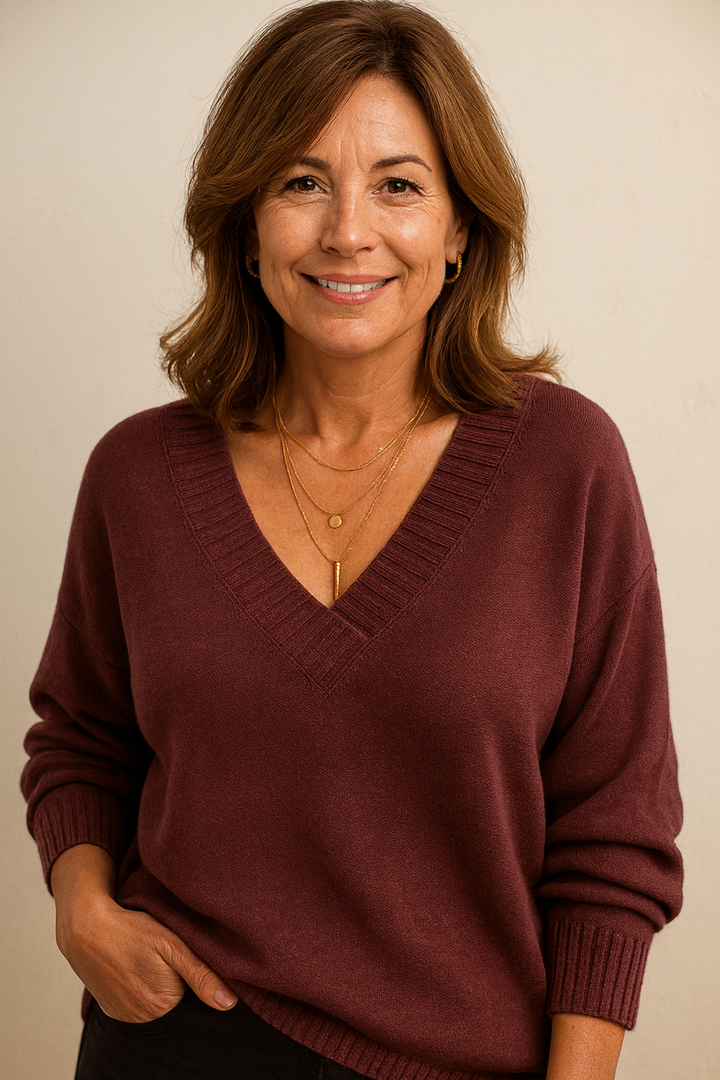 Ultra-soft women's ribbed v-neck sweater. Relaxed fit long sleeve, perfect for cozy everyday wear.