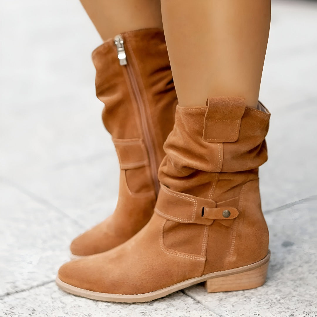 Chic women's ruched ankle boots featuring a convenient side zipper. Trendy casual footwear for versatile styling.