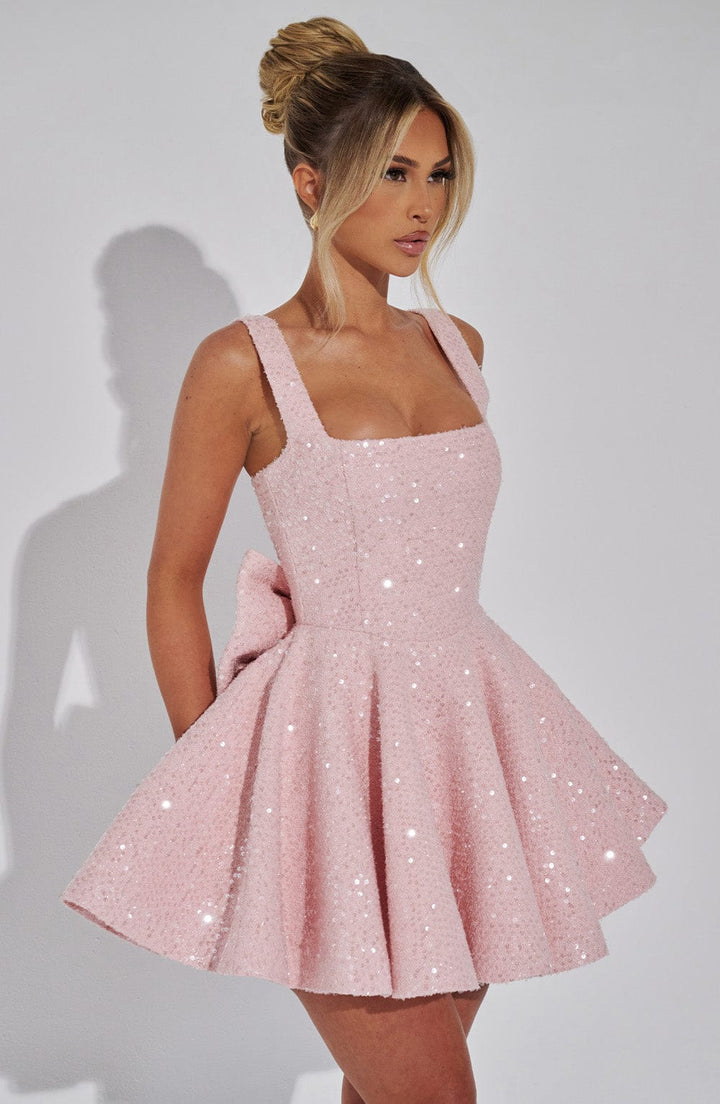 Pink sequin fit & flare mini dress for women, sleeveless, with an elegant back bow for evenings.