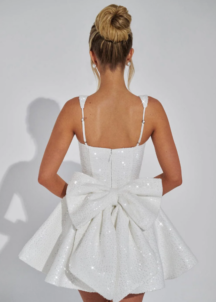 Sparkling women's fit & flare sequin mini dress, perfect for cocktails and special occasions, with a stylish back bow.