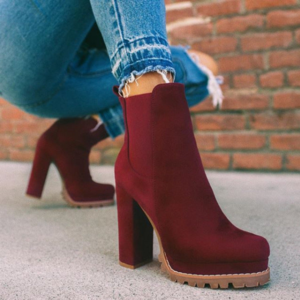 Black suede-look slip-on ankle boots for women. Features platform & block heel. Easy-wear fall/winter fashion.