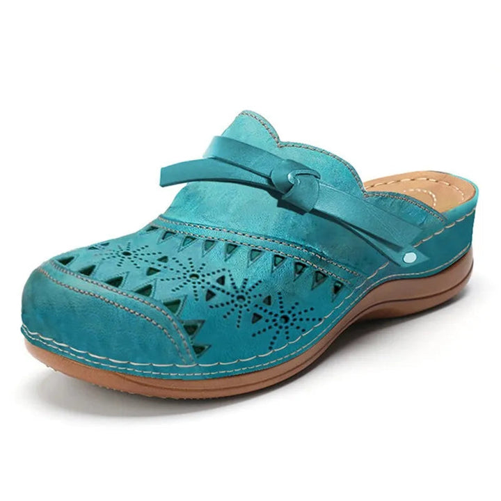 Easy-to-wear women's slip-on clogs with a cute bow and breathable cutout design for casual, everyday style.