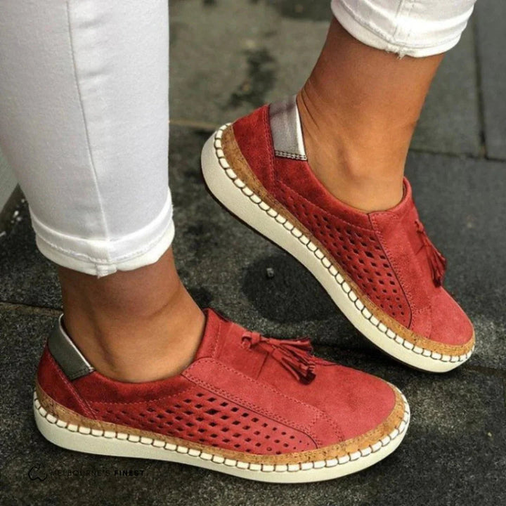 Breathable perforated slip-on women's sneakers, comfortable for everyday wear & summer style.