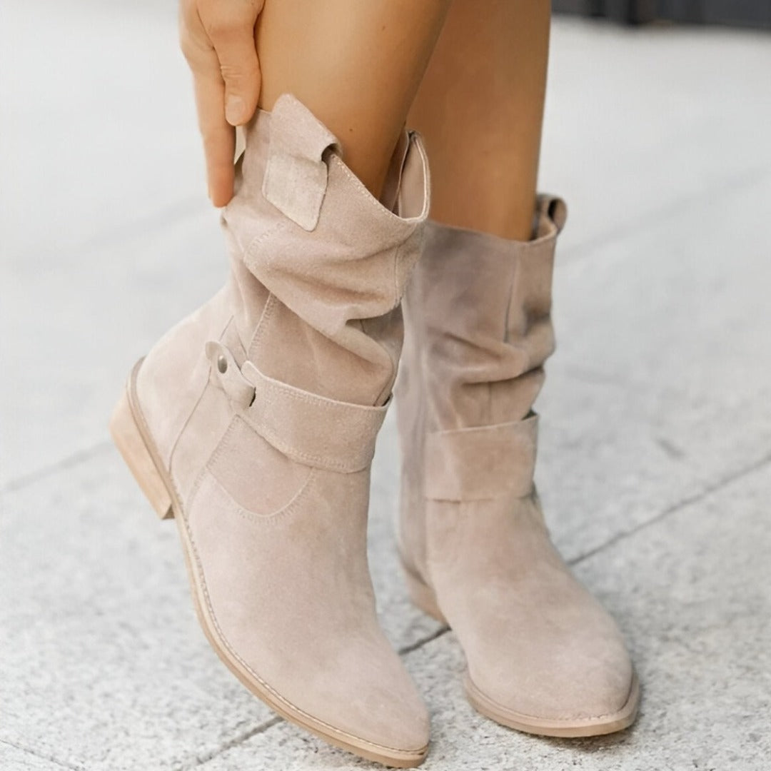 Slouchy women's ankle boots featuring a low block heel and stylish side buckle, great for casual wear.