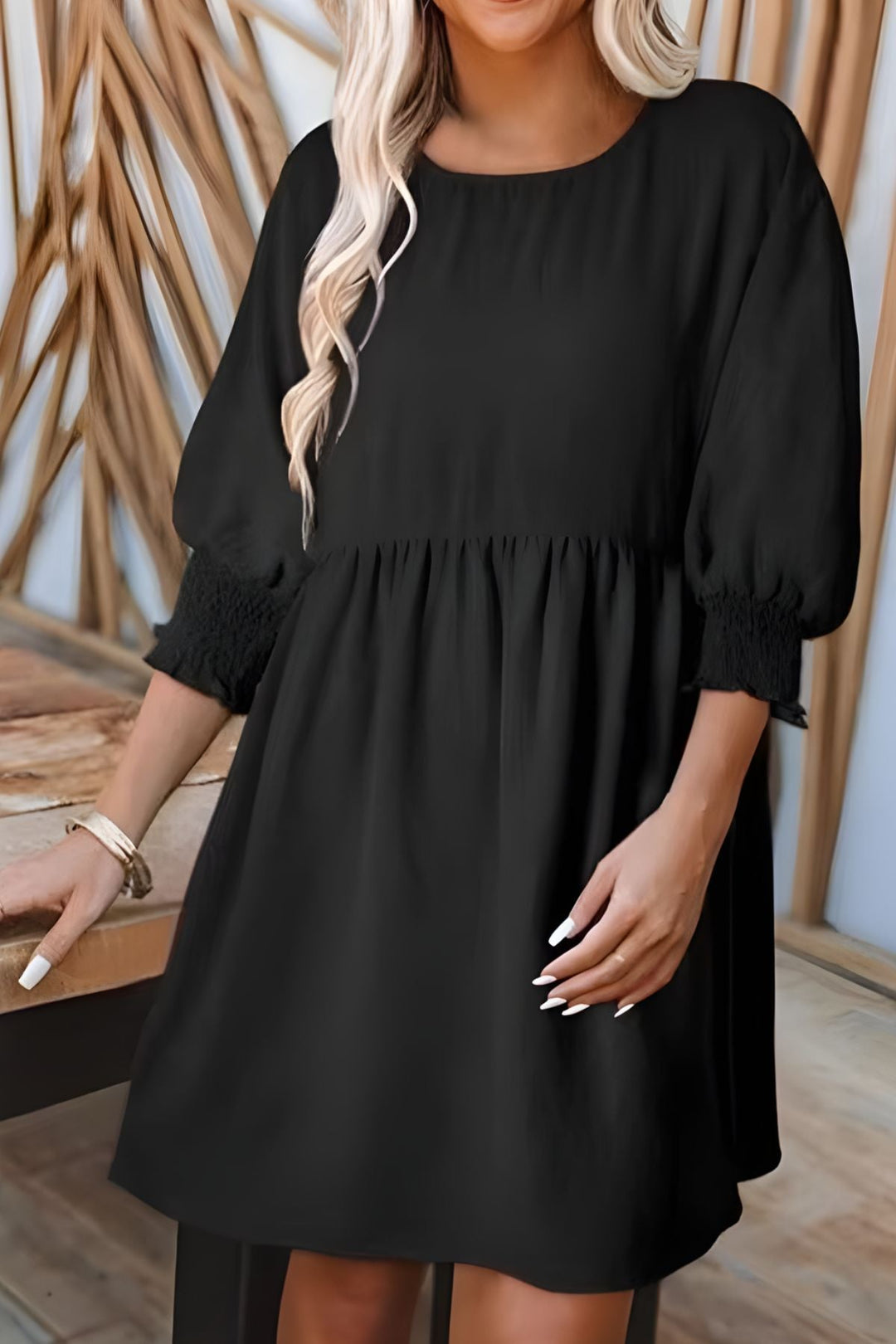 Stylish women's casual mini dress, smocked babydoll fit, half sleeve, perfect for warm weather.