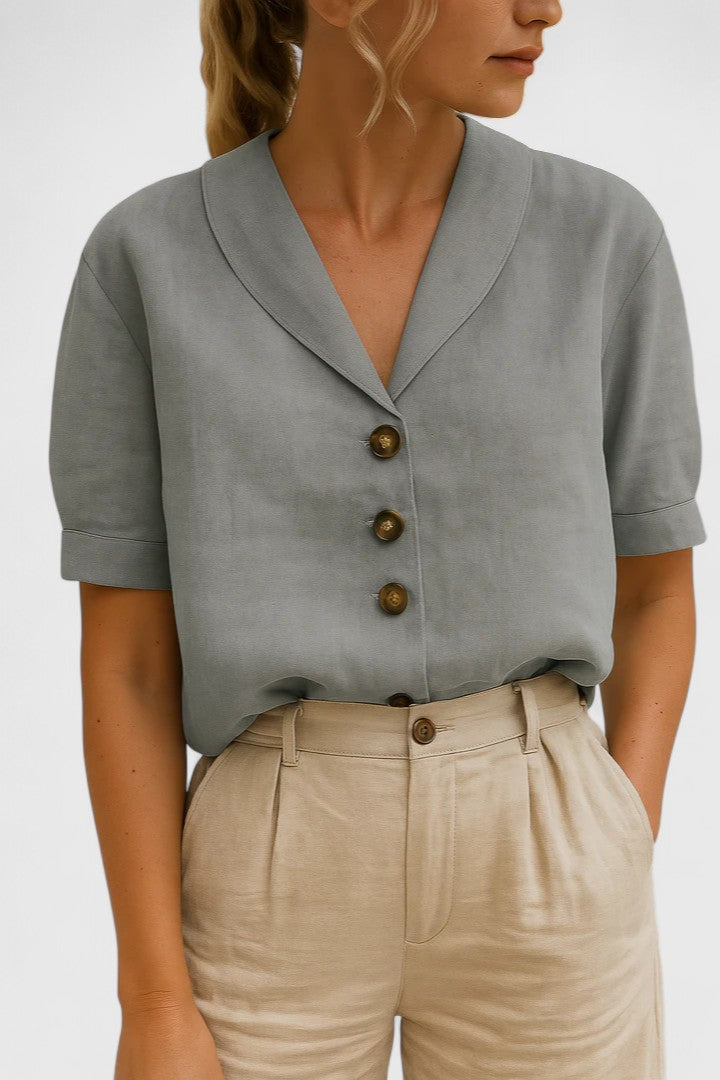 Chic women's button-up blouse, perfect for spring/summer fashion. Stylish and elegant long sleeve top.