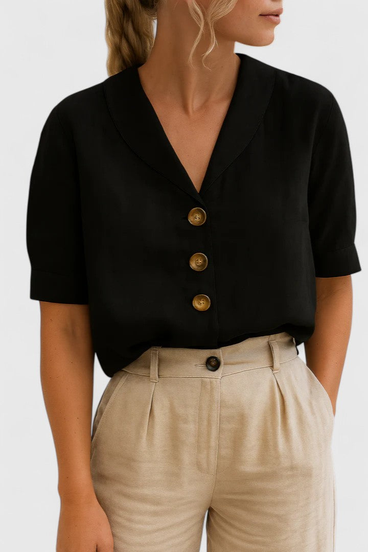 Stylish women's long sleeve button-up blouse. Versatile for office wear or a chic casual spring look.