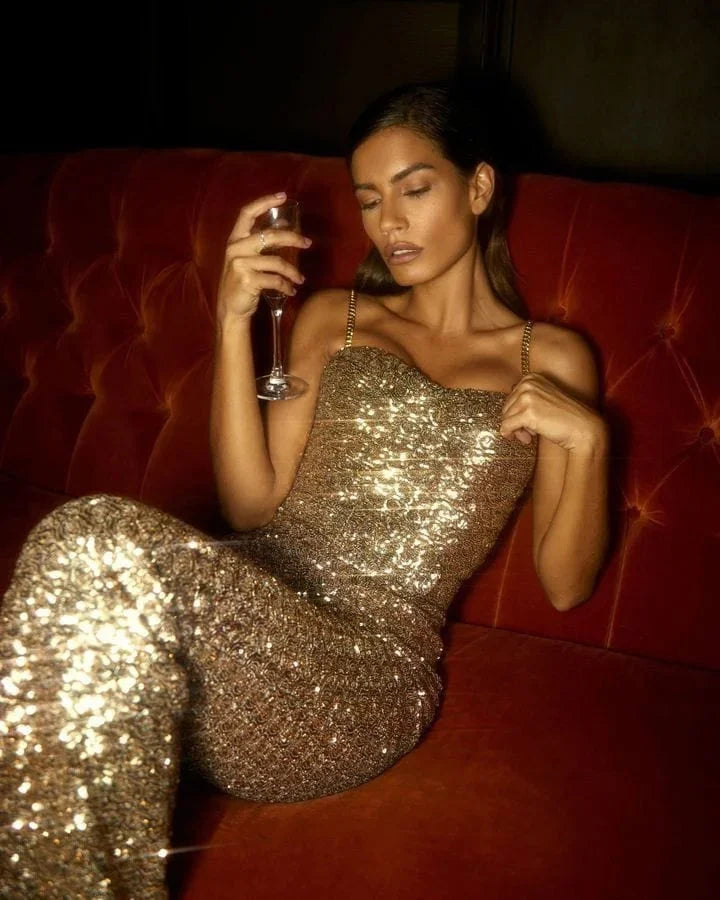 Elegant gold glitter jumpsuit for women, strapless with chic waist belt, ideal for formal & special occasions.