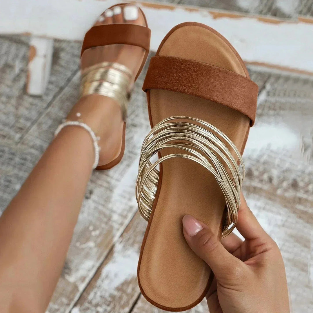 Casual women's open-toe flat sandals, strappy slip-on style for comfortable beachwear and everyday summer.