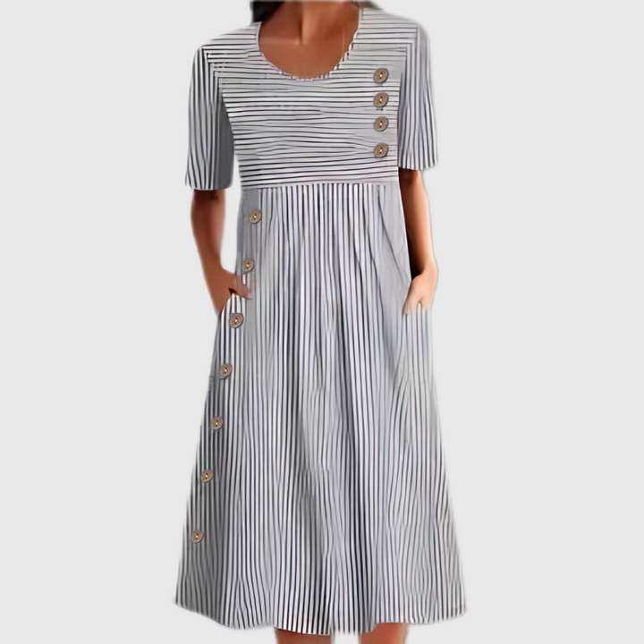 Relaxed fit women's striped midi dress with functional buttons. Ideal for comfortable daily and casual style.