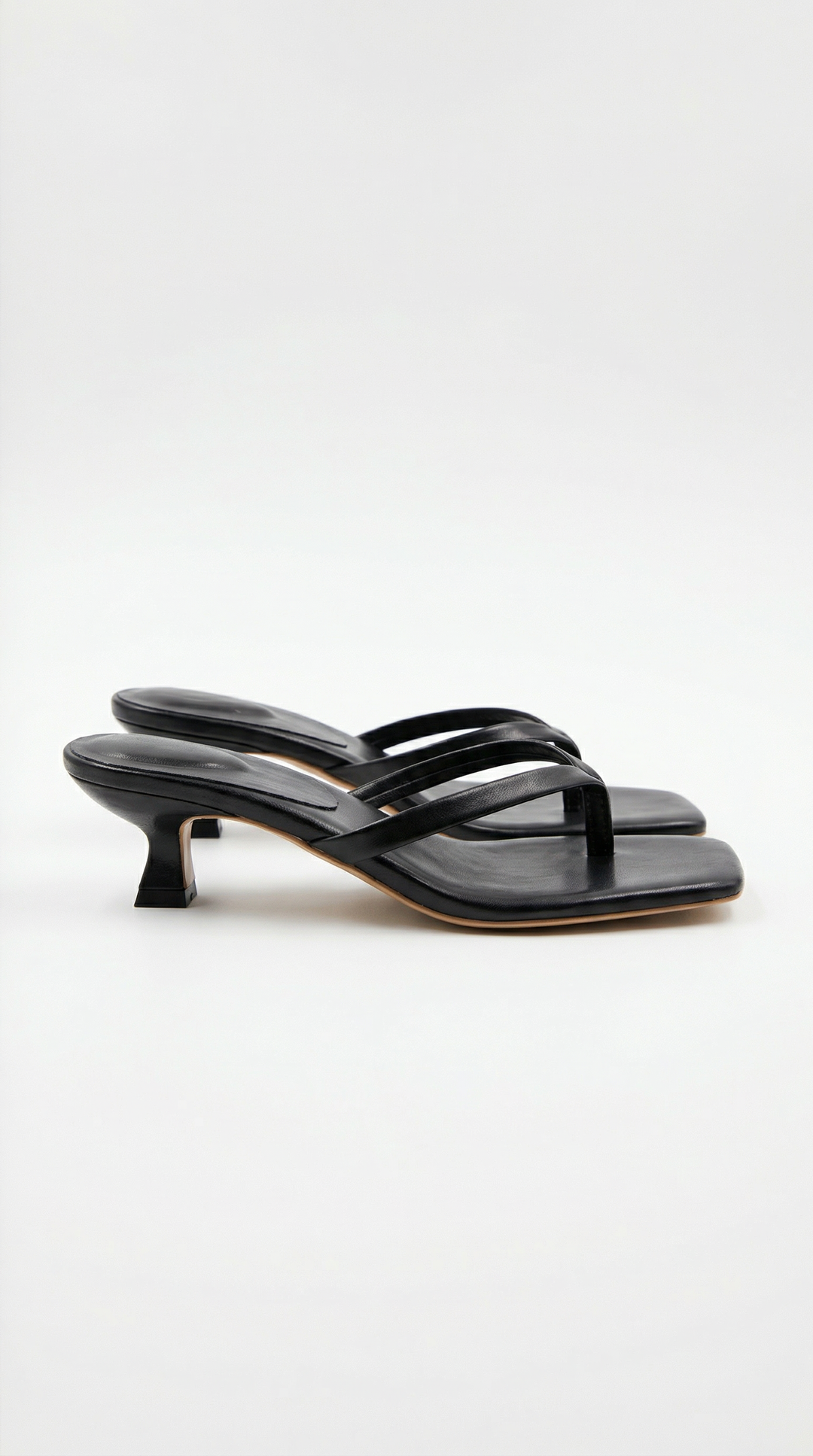 Women's stylish black thong kitten heel sandals for elegant summer occasions.